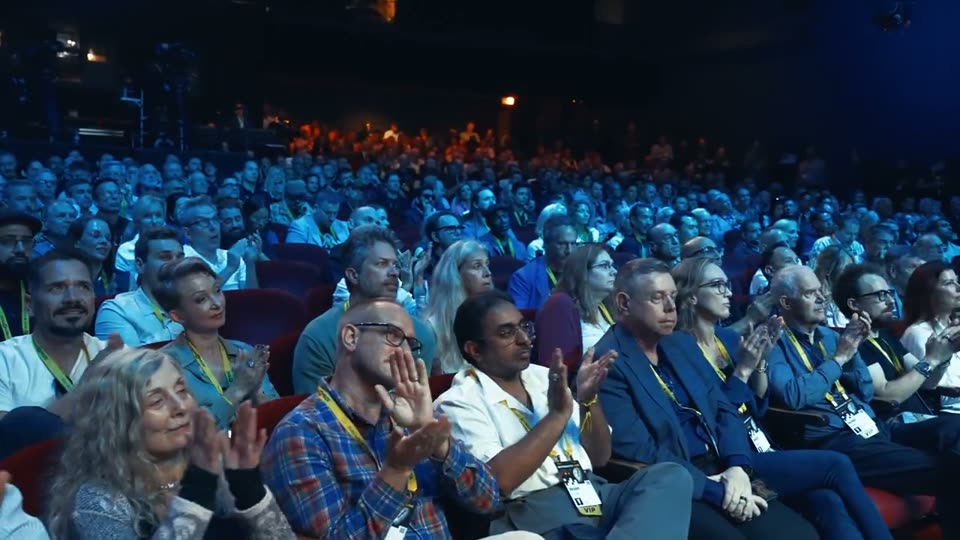 The audience on its feet, applauding